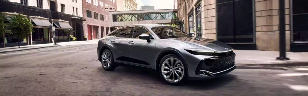 An all-new Heavy Metal 2024 Toyota Crown driving through the downtown streets of Pocatello, ID.