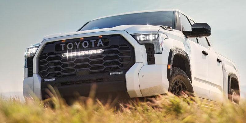 White 2026 Toyota Tundra driving through grass in Pocatello, ID